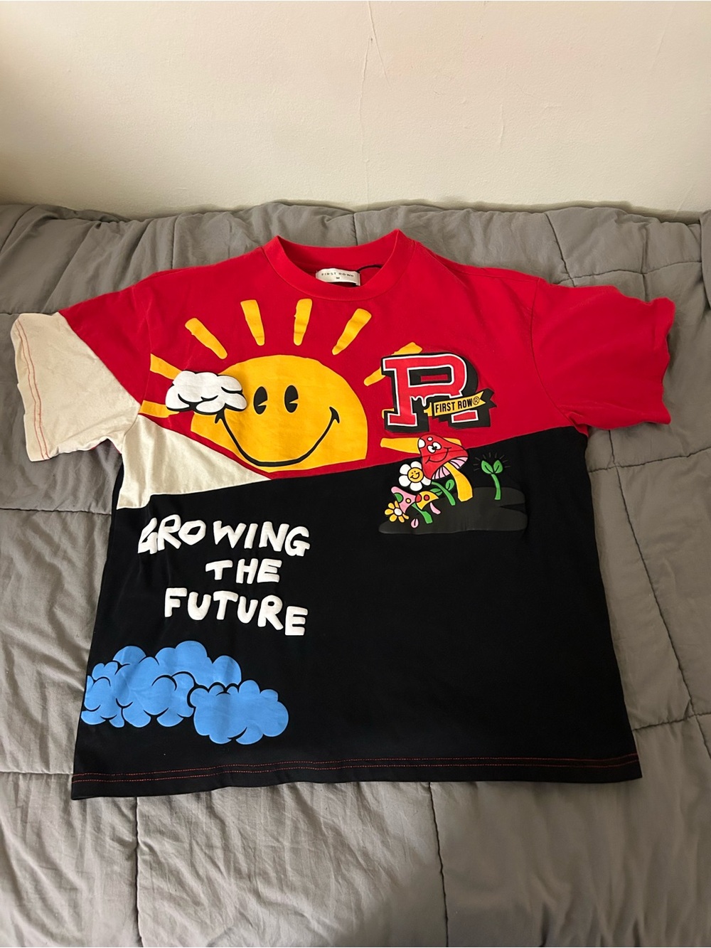 Men’s graphic first row growing the future tee